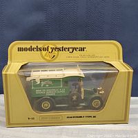 Photo of boxed 1910 Renault Type AG Matchbox model from Models of Yesteryear series, featuring Perrier advertising on side panel.