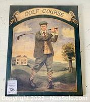 Vintage-style framed artwork showing a golfer in traditional golf attire holding a club with a golf course scene in the background, labeled 'Golf Course'.