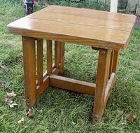 Front and side view of solid pine end table showing top and vertical slatted legs with cross supports.