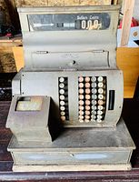 Front view of vintage National cash register showing keys and display panel.