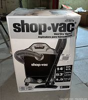 Front of box showing Shop-Vac brand, Wet/Dry Vacuum, 14 gallon capacity, 4.5 peak HP motor.