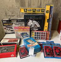 Full view of the lot showing power tools, hand tools, and boxed tool sets including a Craftsman circular saw and rotary tool kit.