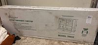 Box of O’Sullivan entertainment center cabinet model 78952, showing printed sketch and product details on the cardboard packaging.