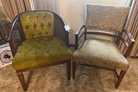 Two vintage chairs side by side: green velvet club chair with tufting and cane sides, beige patterned accent chair with wooden arms