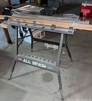 Front view of Wen All Bench folding workbench showing legs and 'All Bench' branding.