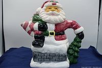 Front view of ceramic Santa Claus teapot showing detailed paint and design
