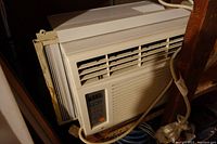 Full view of the Zenith window air conditioner unit installed with its side panels.