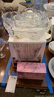 Two crystal bowls shown, one displayed on its original Fifth Avenue box, along with a pink box for cherub place cards.