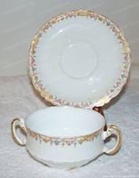 Image of Theodore Haviland Limoges bouillon soup cup and saucer set showing front view with floral pattern and gold trim