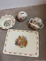 Full set showing all ceramic pieces and cork placemat arranged on floor.