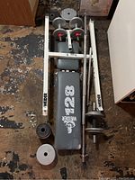 Overall view of Weider 1428 adjustable weight bench with dumbbells, barbell in white frame on floor