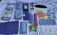 Overview of ice packs and ice cream pop makers arranged on a white surface