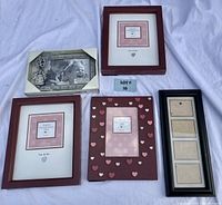 Set of five picture frames on a white background showing various sizes and themes including Valentines, Grand Kids, and a black multi-slot frame