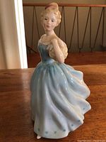 Front angle showing full dress and face of Royal Doulton figurine 'Enchantment' HN2178.