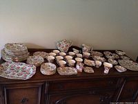 Wide view of all lot pieces displayed on table
