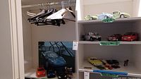 Wide view of model cars on shelving including Volkswagen models and other miscellaneous cars