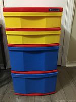 Front view of the Gracious Living storage tower with color-coded drawers: two yellow on top, two blue at bottom, red framing.