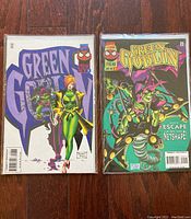 Photo of two Green Goblin comics in comic sleeves with backer-boards, colorful cover art visible with Marvel Comics and Spider-Man logo