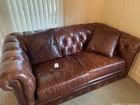 Front view showing overall tufted design and cushion wear