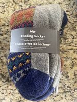 Top view of packaged Indigo Reading Socks showing brand label and color pattern.