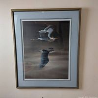 Full view of framed print showing two herons in flight, matted and framed