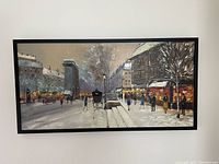 Frontal view of entire framed painting showing snowy street scene.