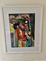 Full view of framed watercolor painting with white frame and mat