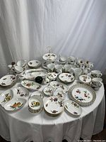 Overall group view of entire porcelain lot on table
