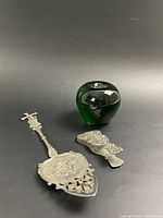 Photo showing the two sterling silver pieces with a green glass apple for size reference