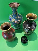 All three cloisonné vases and green apple reference