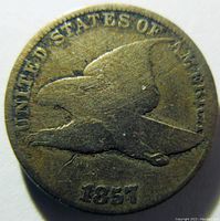 Obverse of 1857 Flying Eagle cent showing flying eagle with broken die rim cud over the ERICA of America on the rim.