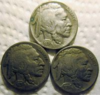 Obverse side of the three 1936 Buffalo Nickels from P, D, and S mints showing Native American profile.