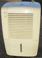 Front view of Frigidaire dehumidifier showing air vent and water level indicator.