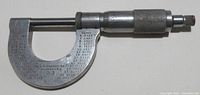 Full view of the Starrett No. 3 micrometer showing the frame with conversion chart and screw mechanism.