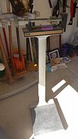 Full view of the vintage Counselor weight scale showing the pedestal and weighing platform.