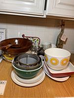 Full view of the assorted bowls and kitchen items displayed on countertop.