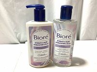 Front view of the Biore cleanser and toner bottles showing size, label, and pump/flip caps.