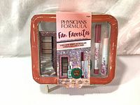 Front view of the sealed Physicians Formula makeup gift set with visible product inside pouch.