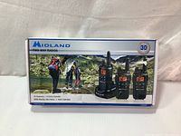Box front showing Midland branding and image of three radios with features listed