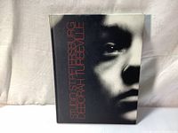 Front cover of 'Studio St. Petersburg' showing a close-up face photograph in black and white with title and author in red text.