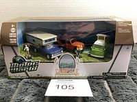 Front view of boxed die-cast Motor World Campsite Cruisers set, showing all vehicles and figures in packaging.