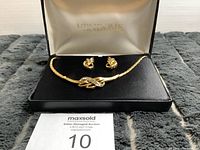 Necklace and earrings displayed in open Vendome branded box, showing the full set, box interior, and auction lot card.