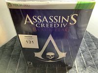 Front cover of the Assassin's Creed IV Black Flag Xbox 360 game box with sticker
