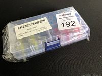 Sealed plastic box with label showing 100PCS Solder Seal Wire Connectors Kit, unopened packaging.