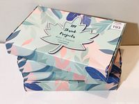 Four sealed boxes of 'Shrink Projects' DIY kits with pastel-colored leaves and floral design shown stacked
