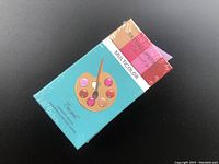 Photo of one box front side, turquoise color with a color palette image labeled MULTICOLOR.