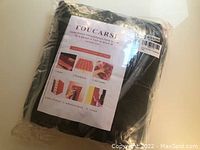 Packaged black acoustic foam panel labeling 'FOUCARSI' showing uses and product benefits
