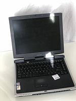 Open Toshiba laptop showing screen and keyboard.