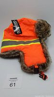 Orange high visibility Dakota work hat with reflective stripe and faux fur trim and lining.