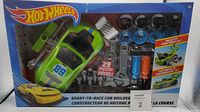 Full boxed set showing car, wheels, parts, and tools.